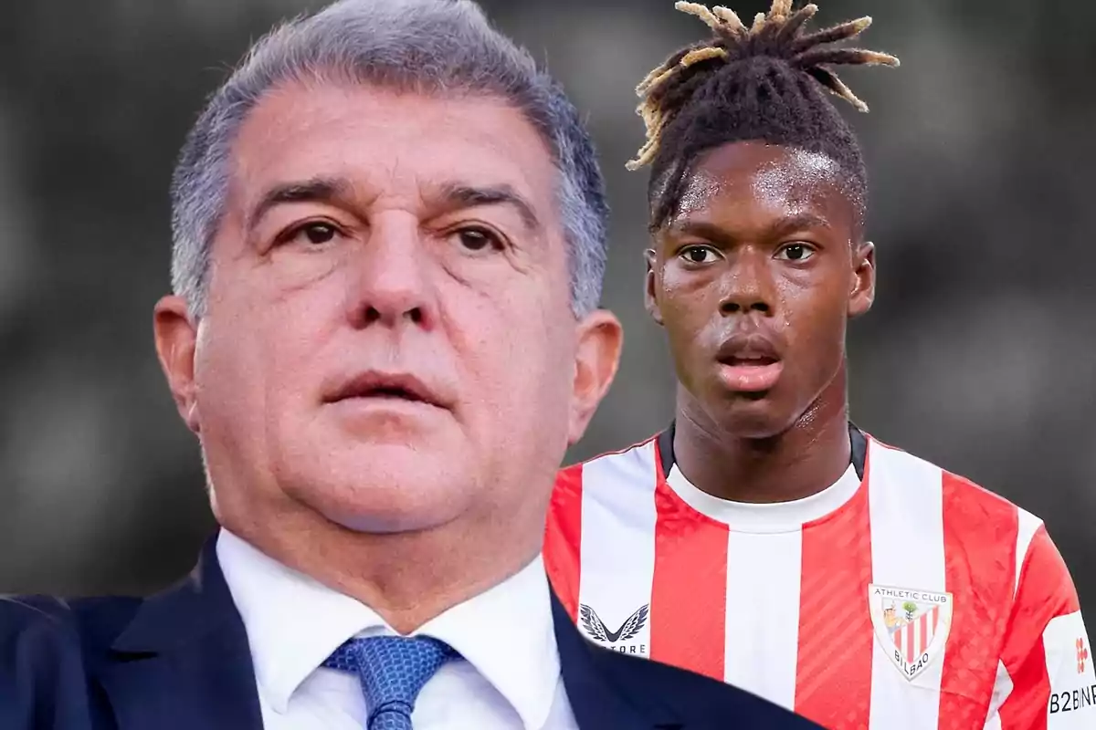 Two men, one in a suit and tie and the other in an Athletic Club de Bilbao soccer uniform, pose together in the picture.
