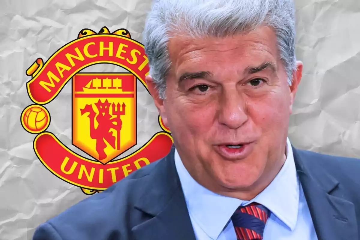 A gray-haired man in a suit and tie in front of the Manchester United logo.