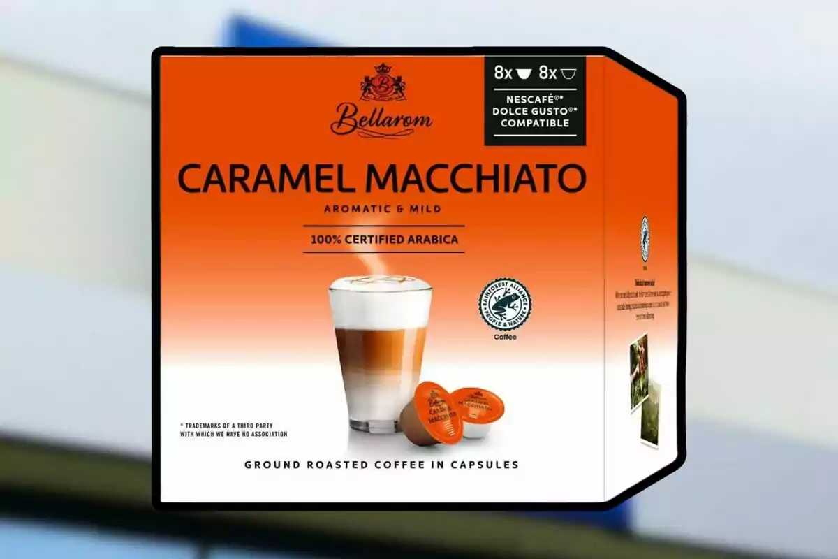 Bellarom Caramel Macchiato coffee capsule box with an orange and white design featuring a glass of frothy milk coffee and two capsules at the bottom. Bellarom Caramel Macchiato coffee capsule box with an orange and white design featuring a glass of frothy milk coffee and two capsules at the bottom.