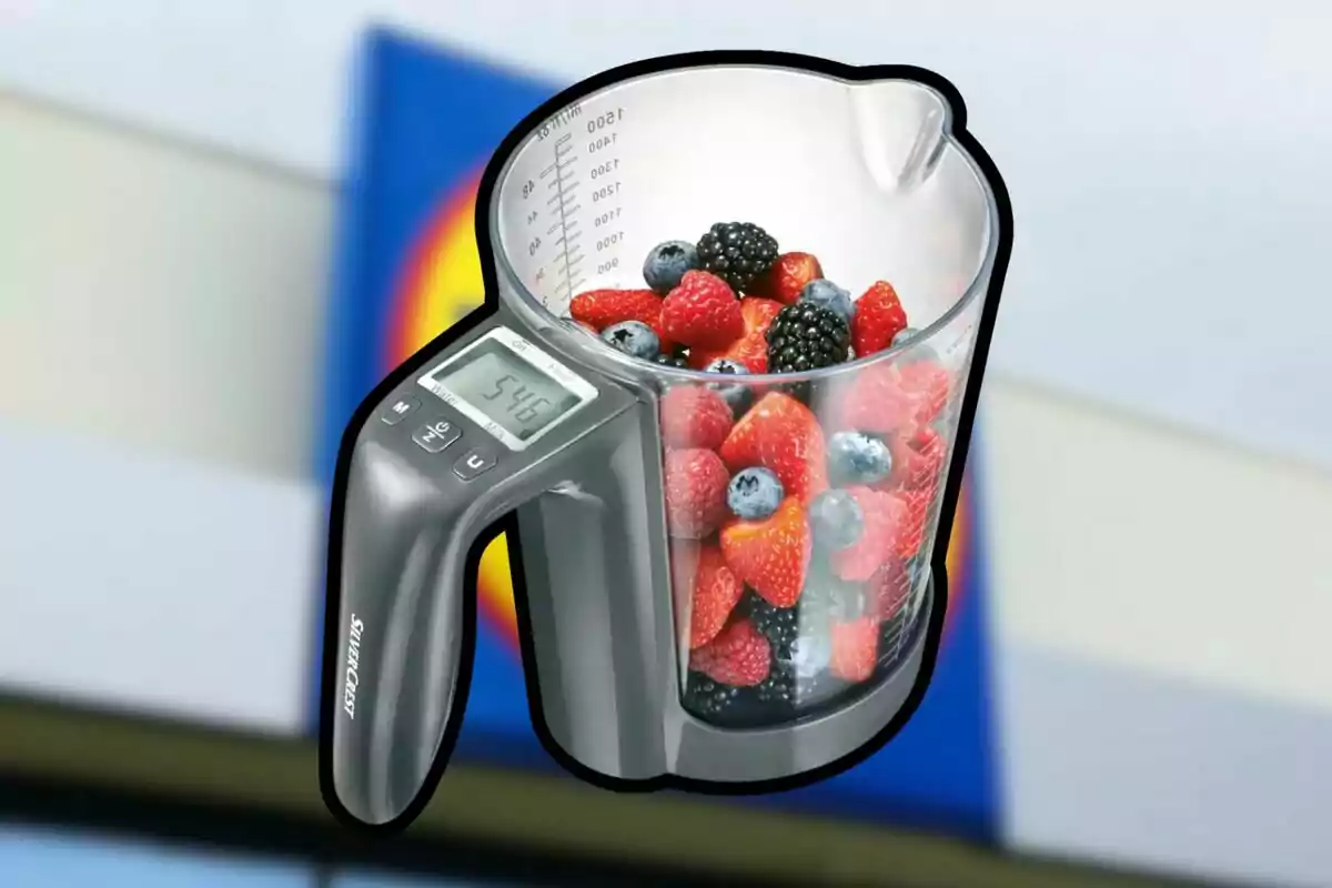 Digital measuring jug with berries inside and a blurred supermarket background Digital measuring jug with berries inside and a blurred supermarket background