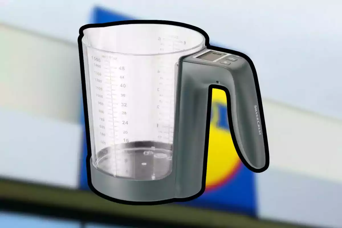 Plastic measuring jug with integrated digital scale and a blurred supermarket background Plastic measuring jug with integrated digital scale and a blurred supermarket background