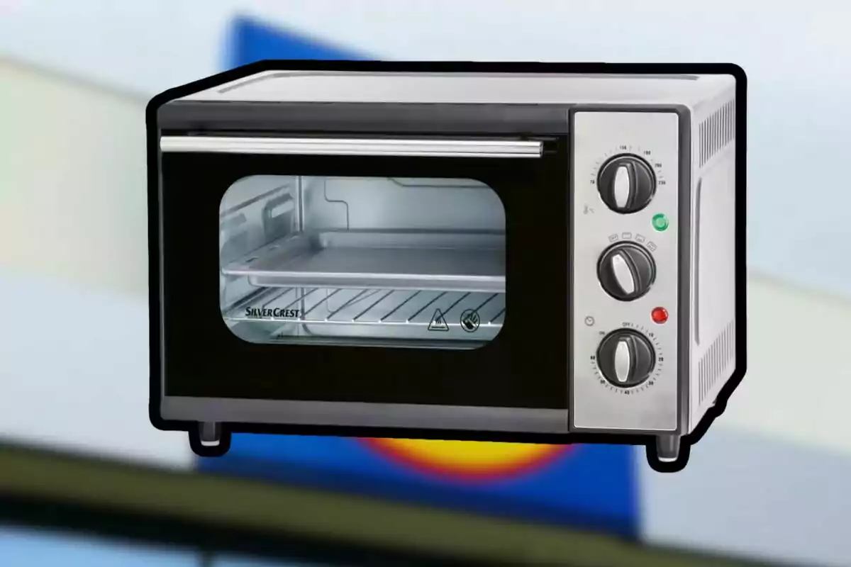 A SilverCrest brand toaster oven with knob controls and a tray inside. A SilverCrest brand toaster oven with knob controls and a tray inside.