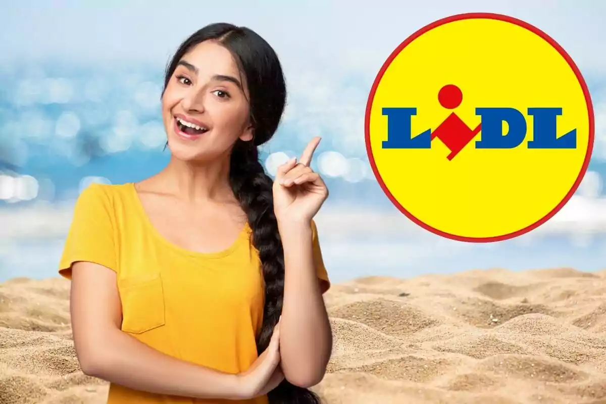 A smiling person in a yellow t-jersey points to the Lidl logo on a beach.