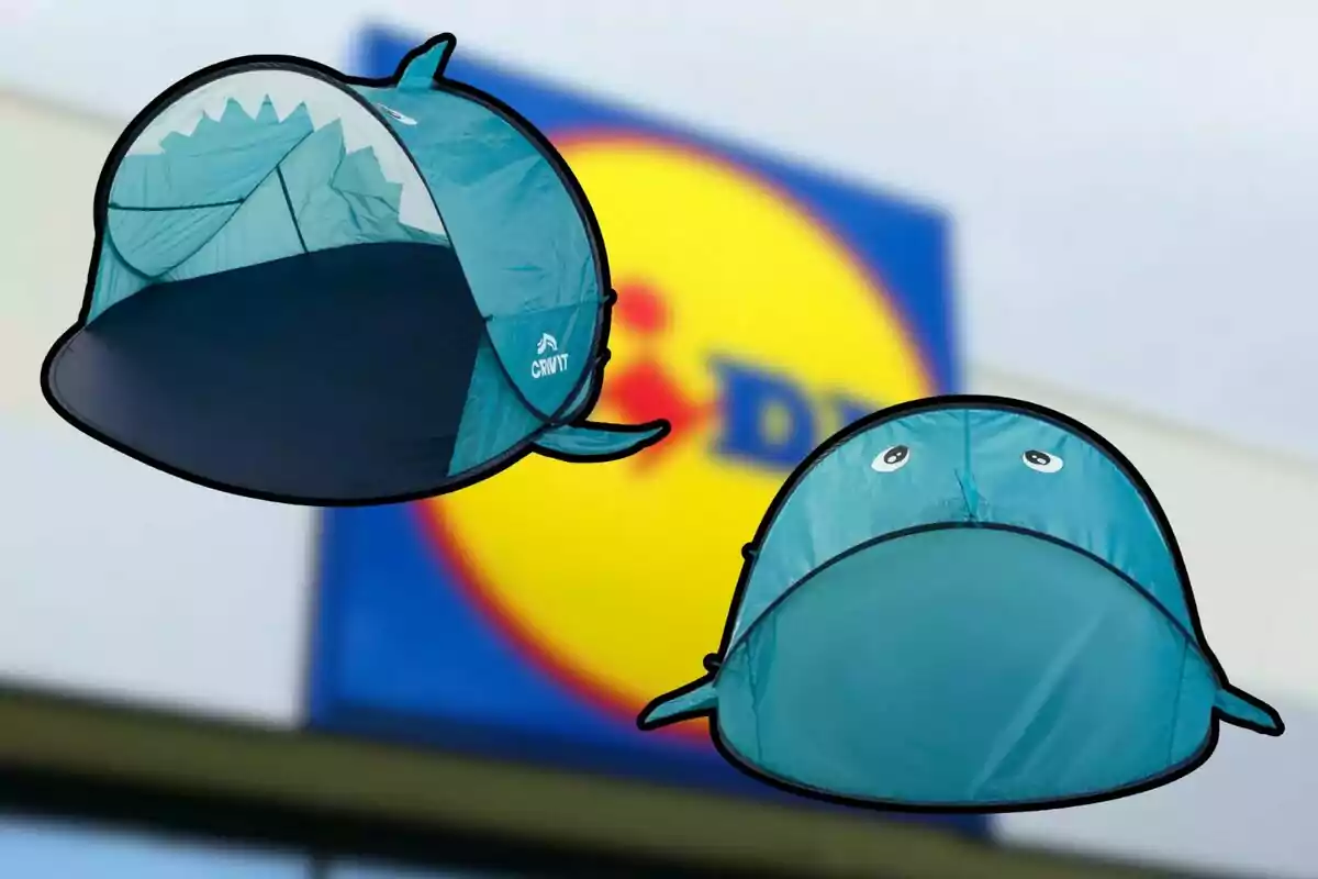Two blue shark-shaped tents float against a blurred background of a supermarket logo.