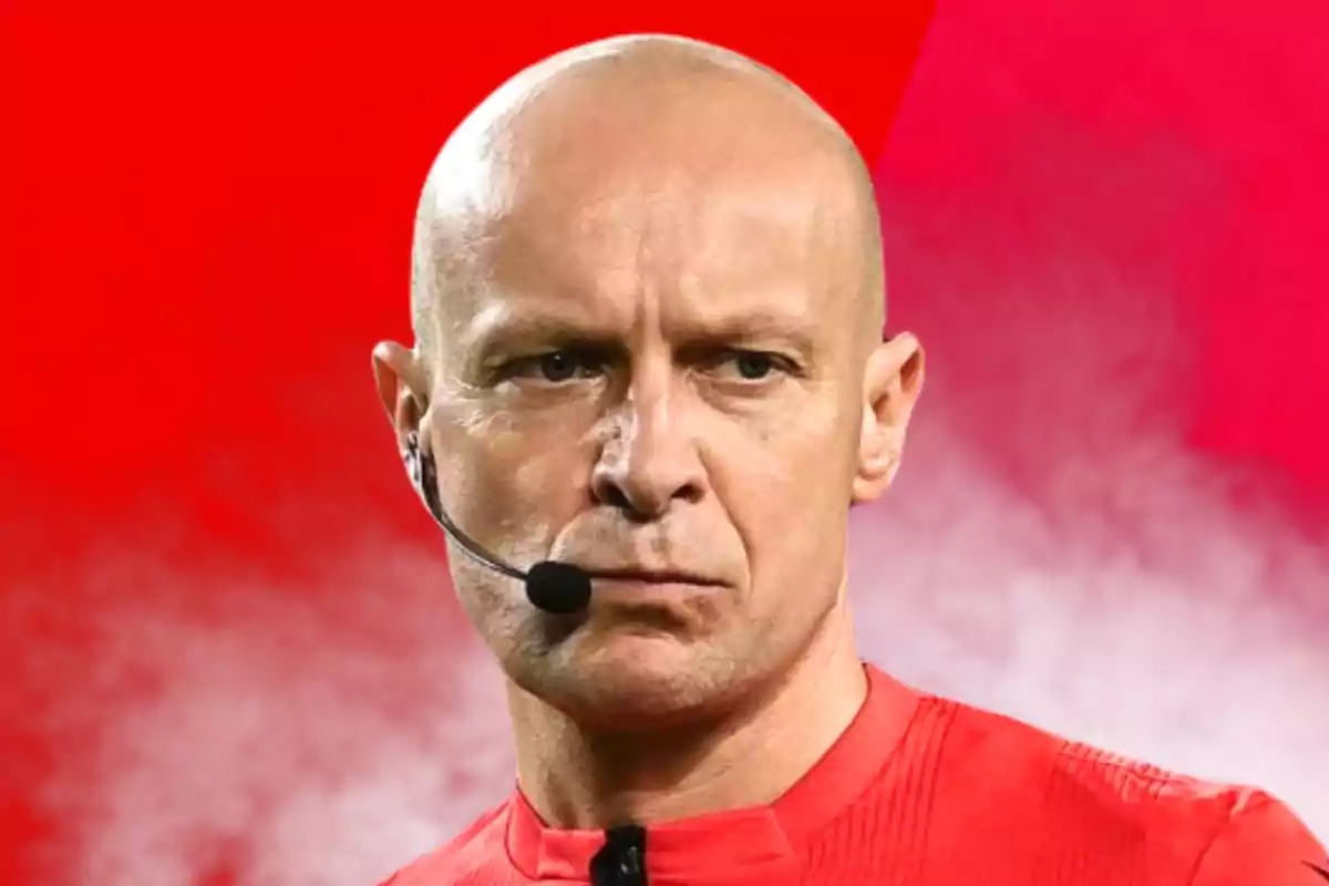 A bald man with a headset and microphone on a red background.