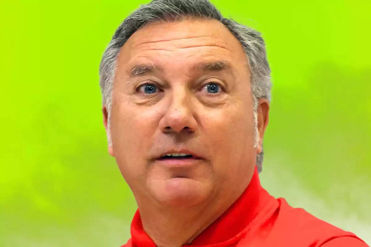 Man with a red jersey on a green background.