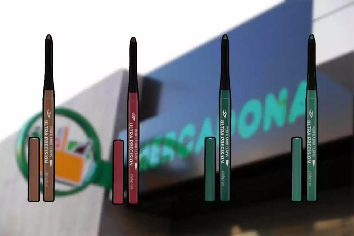 Four Ultra Precision lipsticks in different colors are displayed in front of a supermarket sign. Four Ultra Precision lipsticks in different colors are displayed in front of a supermarket sign.