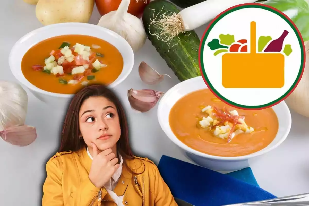 Una dona pensativa amb una jaqueta groga està davant dos plats de sopa de tomàquet amb verdures, envoltada d'ingredients frescos com all, cogombre, patates i tomàquets, al costat d'un logotip d'una cistella d'aliments.