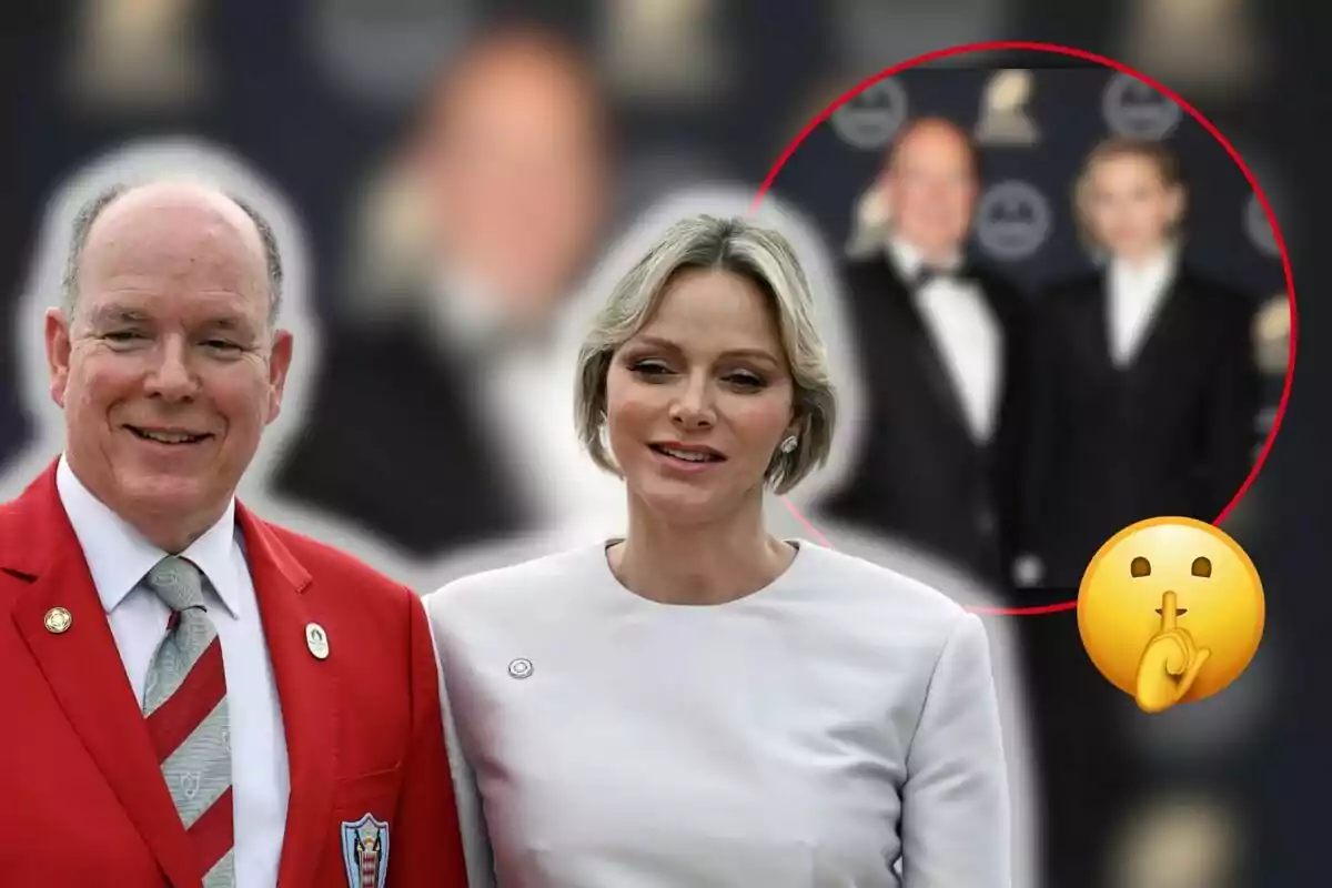 Two people pose together at a formal event, one wearing a red suit and the other a white dress, with a blurred background and a silence emoji in the corner.