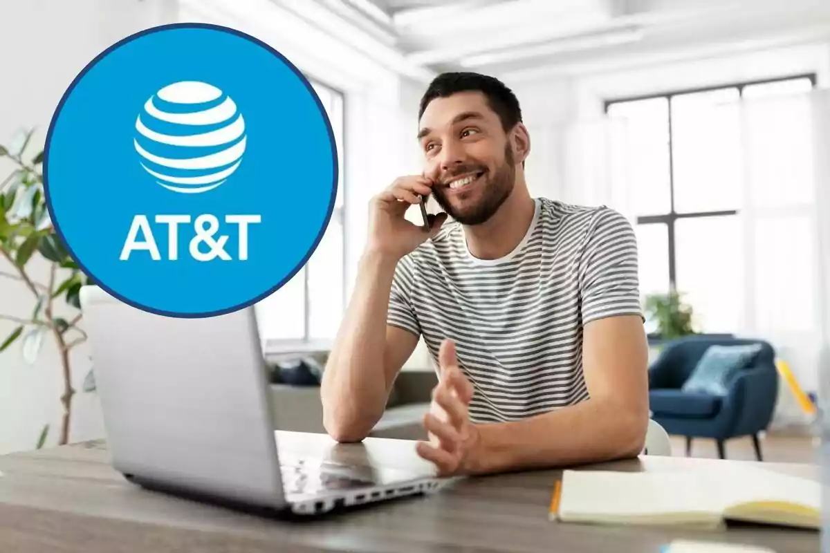 Man smiling while talking on the phone and using a laptop, with the AT&T logo in the corner. Man smiling while talking on the phone and using a laptop, with the AT&T logo in the corner.