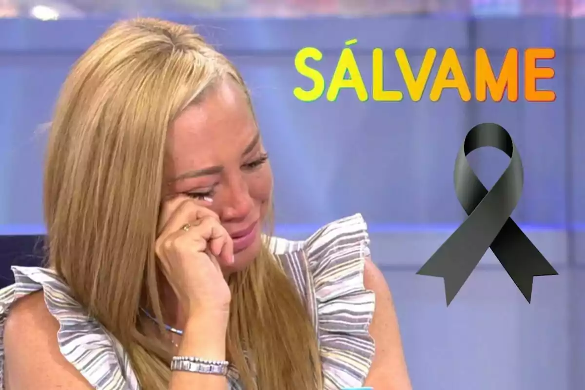 Belén Esteban plorant amb la mà a la cara, amb el text "SÁLVAME" en colors brillants i un llaç negre a la cantonada dreta.