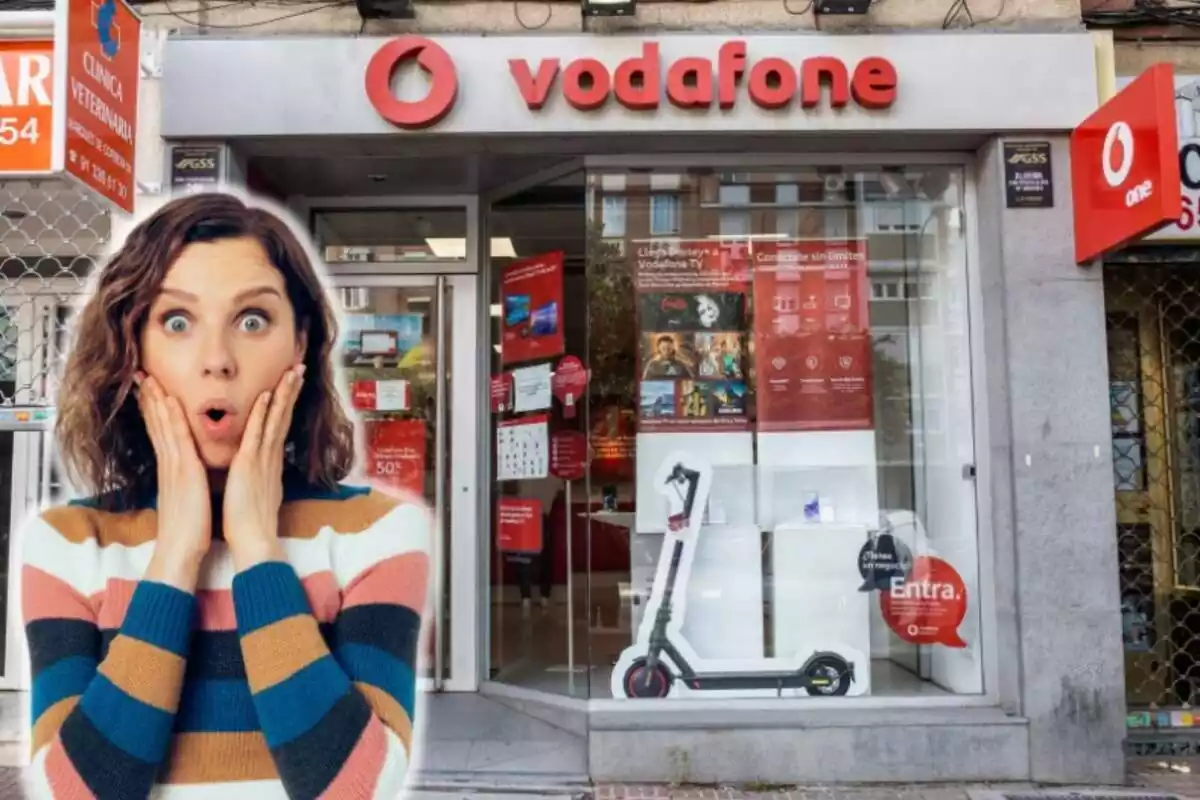 Una dona amb cara de sorpresa, en primer pla, i al fons una botiga de Vodafone