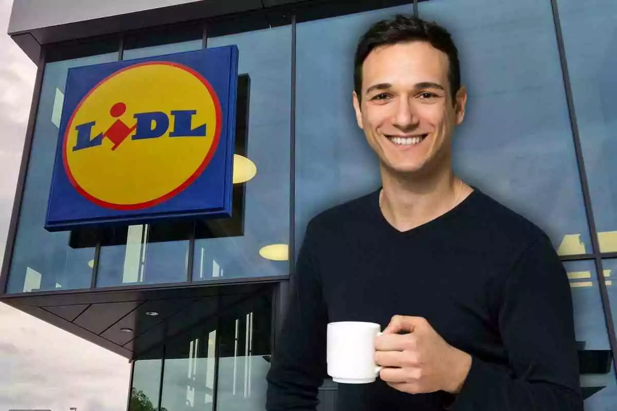 Smiling man holding a cup of coffee in front of a Lidl store