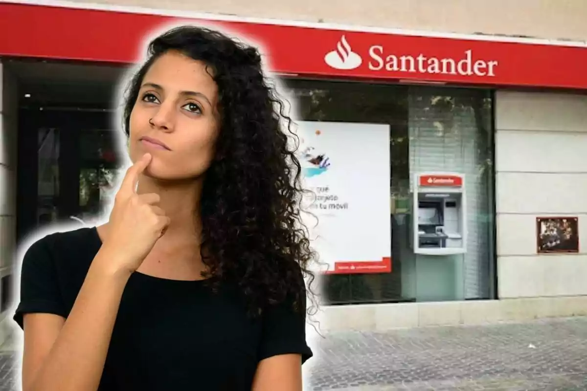 Dona pensativa davant d'una sucursal del banc Santander.