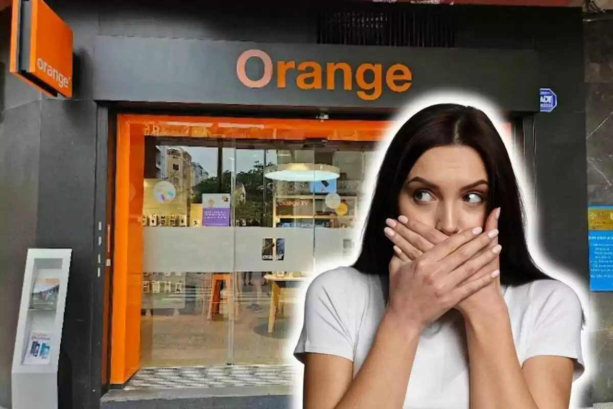 Woman with surprised expression in front of an Orange store.