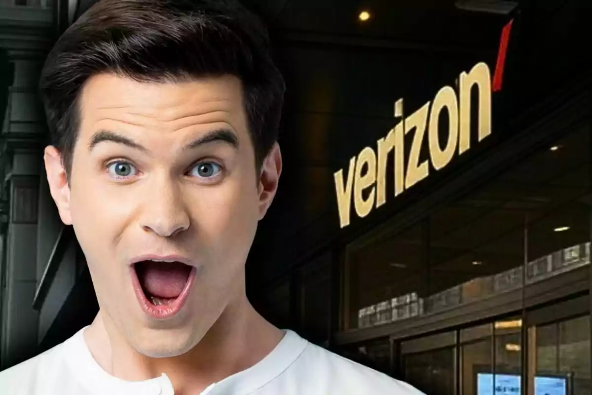 A man with a surprised expression in front of a building with the Verizon logo.