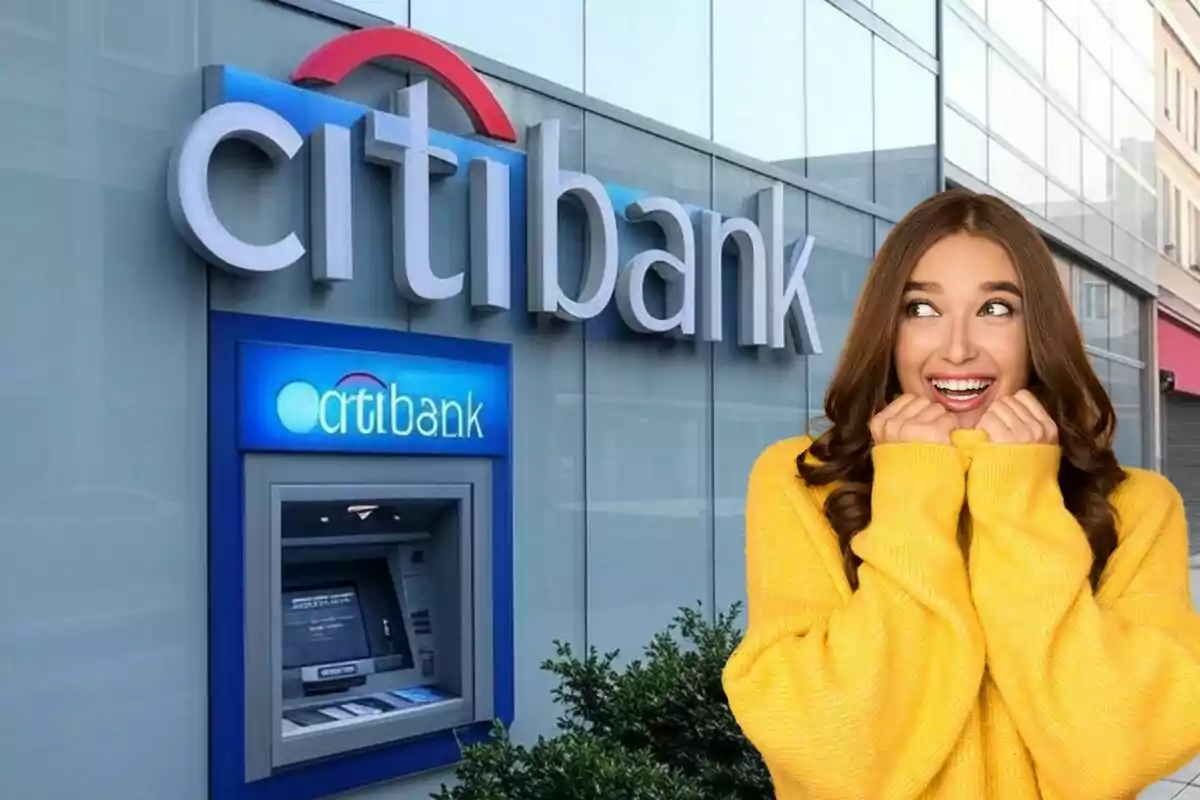 A smiling woman in a yellow sweater is in front of a bank ATM.