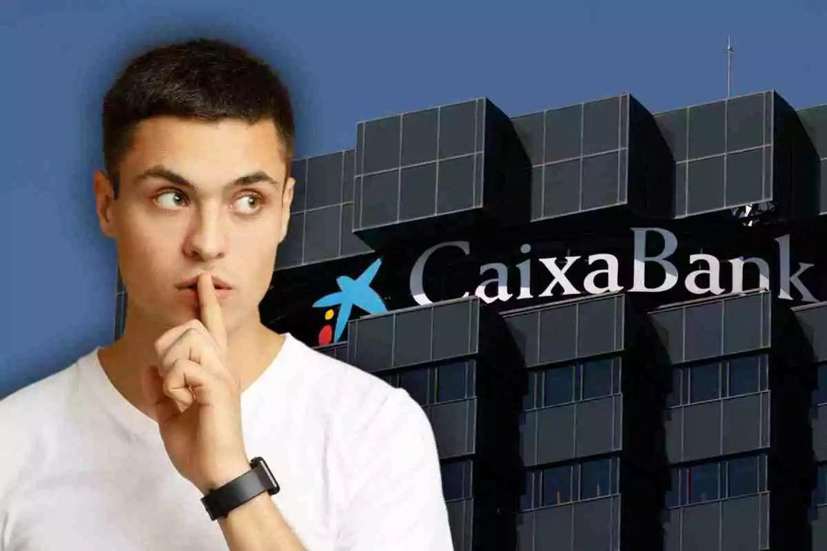 Un home amb gest de silenci davant d'un edifici de CaixaBank. Un home amb gest de silenci davant d'un edifici de CaixaBank.