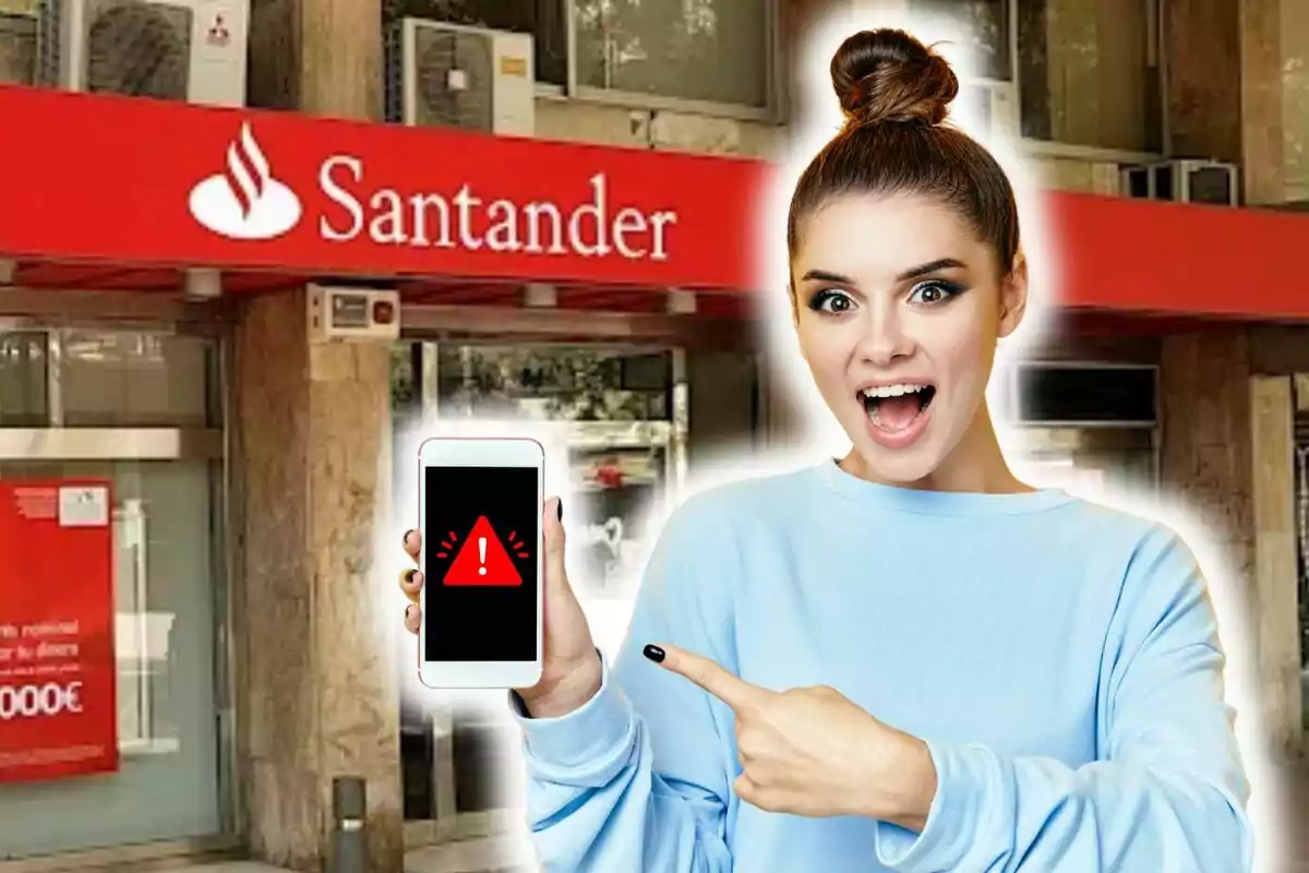 Una dona sorpresa assenyala un telèfon amb una alerta a la pantalla davant d'una sucursal del Banco Santander.