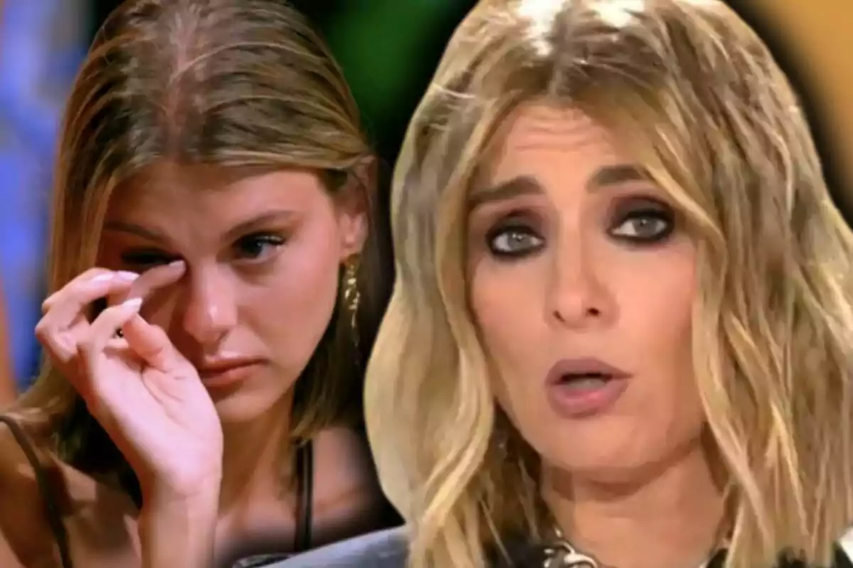 Two women in a picture, one of them is Andrea Arpal crying while the other, who is Sandra Barneda, has a serious expression.