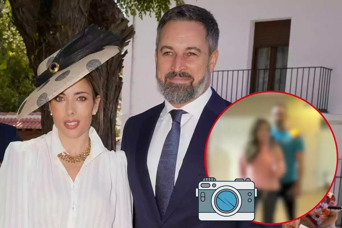 Lidia Bedman i Santiago Abascal posant a l'aire lliure amb un arbre i un edifici de fons, la dona porta un barret elegant i l'home vesteix un vestit formal.