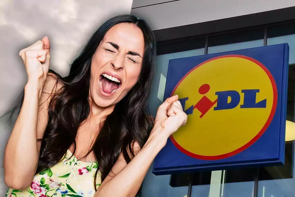 Excited woman with her fist raised in front of a supermarket sign.
