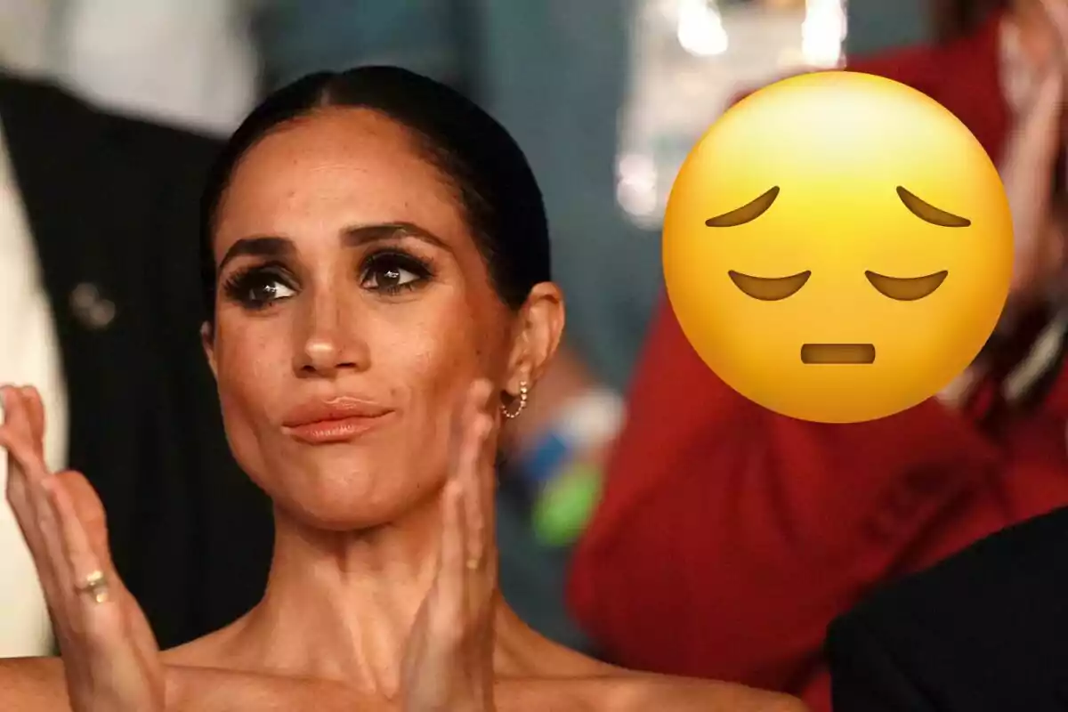 Meghan Markle aplaudiendo con un emoji de expresión pensativa superpuesto.