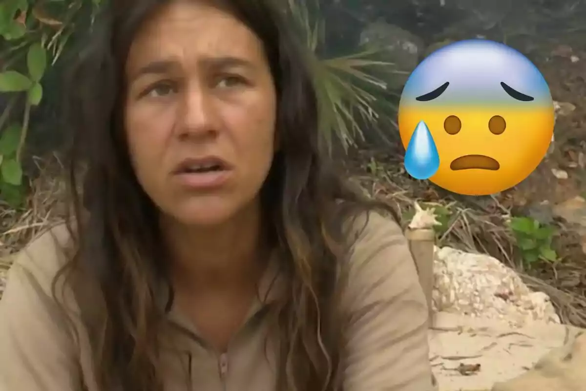 Laura Cuevas amb expressió preocupada en un entorn natural amb un emoji de cara trista i suor al costat.