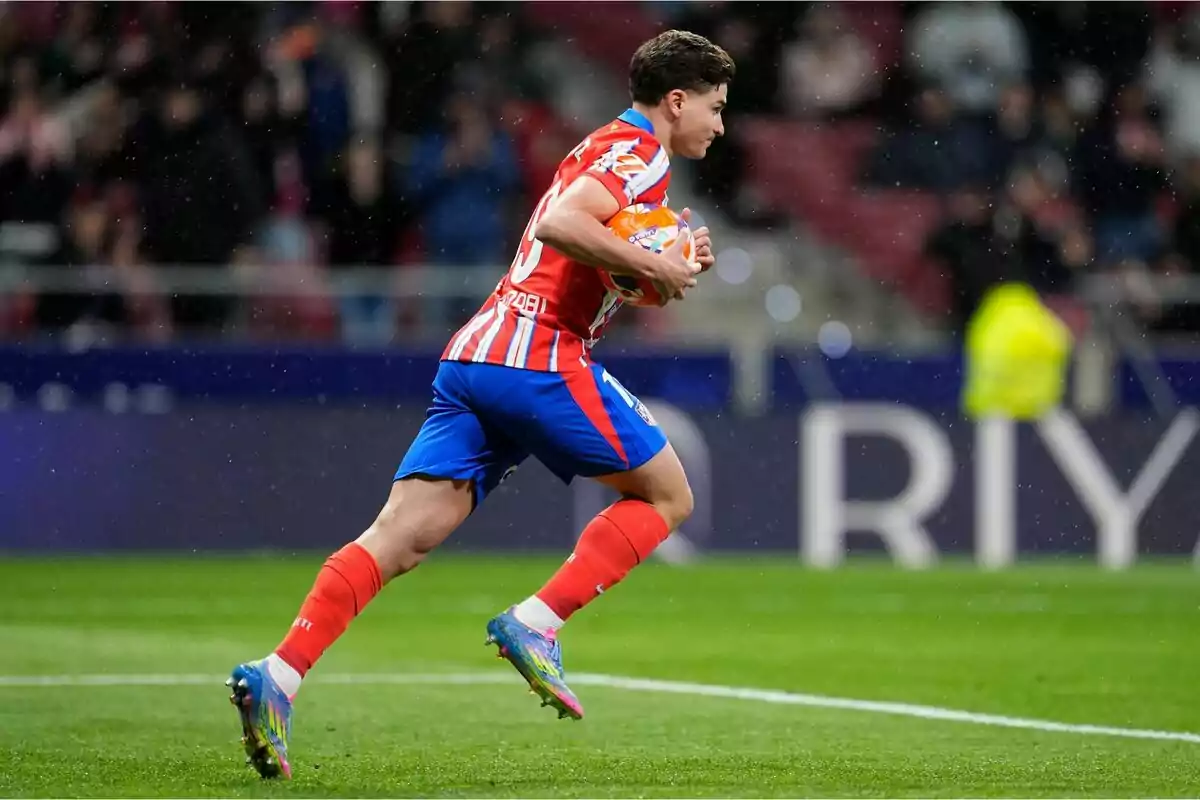 Football player running on the field with the ball in his hands during a game. Football player running on the field with the ball in his hands during a game.