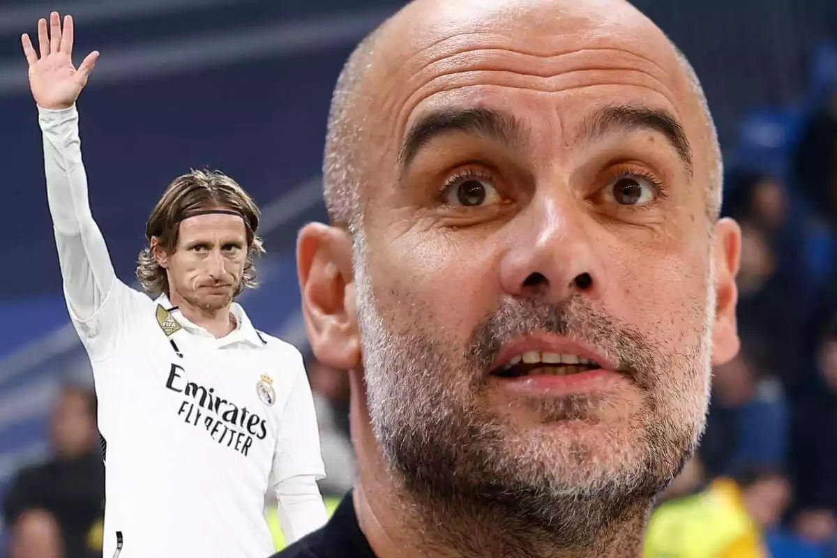 Pep Guardiola en primer pla amb Luka Modric aixecant la mà al fons