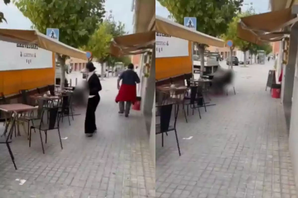 Un carrer amb taules i cadires exteriors al costat d'un restaurant amb persones caminant.