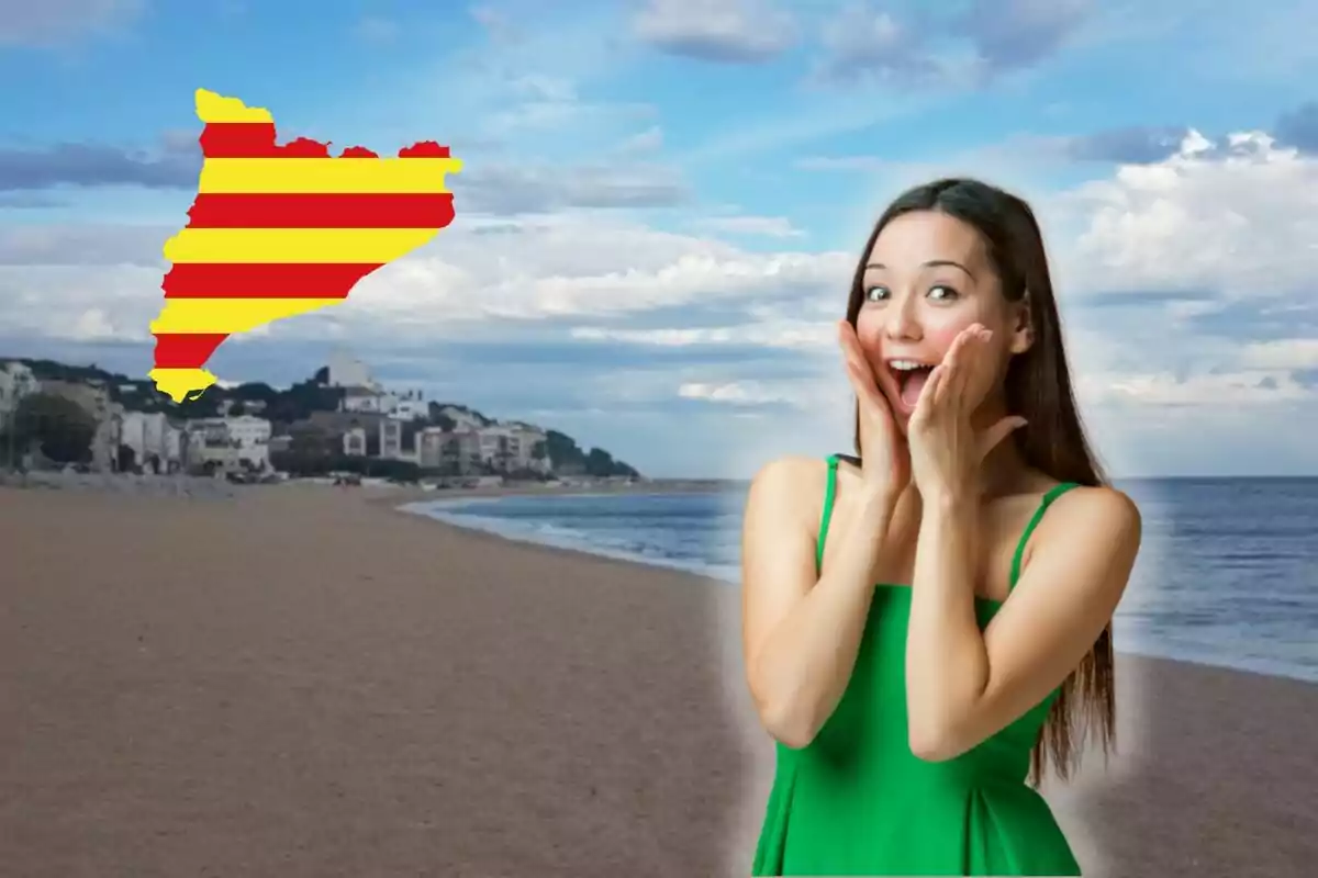 Una dona sorpresa a la platja amb la bandera de Catalunya al cel.