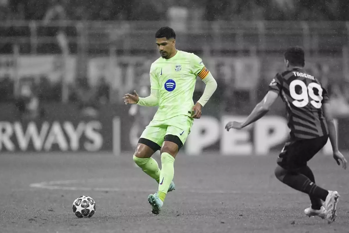 A player in a light green uniform controls the ball as an opponent approaches on the field. A player in a light green uniform controls the ball as an opponent approaches on the field.