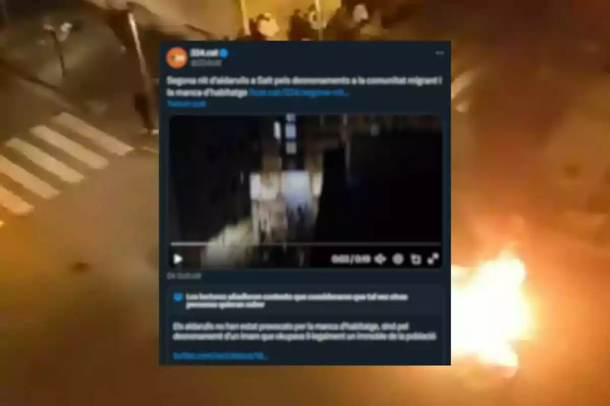 Una captura de pantalla de un tuit que muestra un video sobre disturbios en Salt, con un fondo de una calle en llamas.