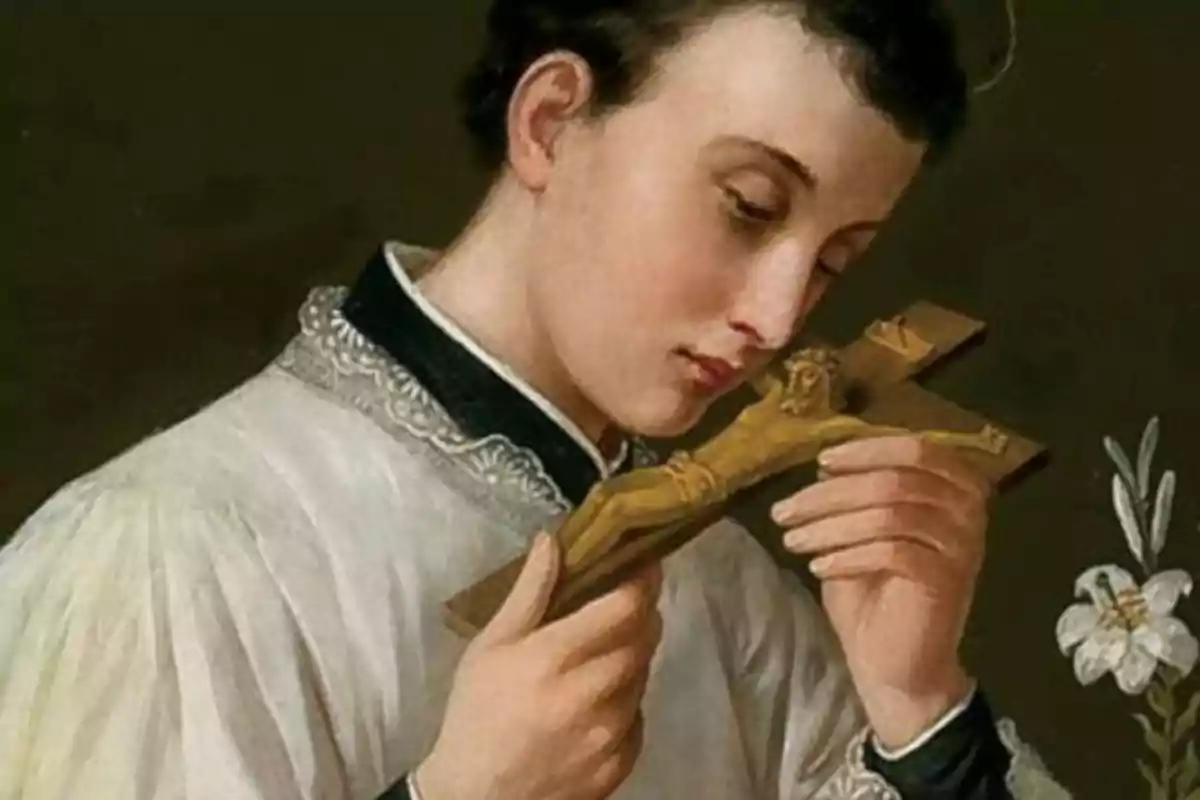 Priemr pla a color de San Luis Gonzaga besant un crucifix