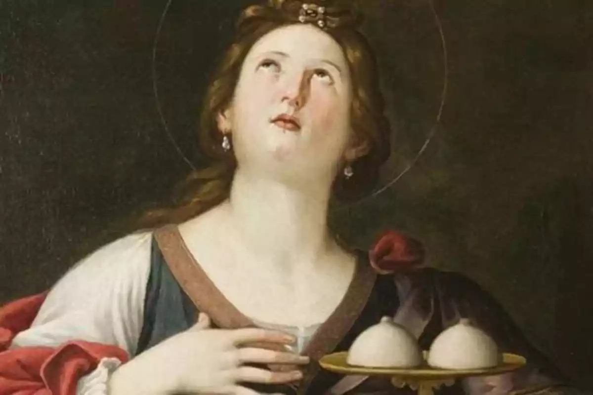 A classical painting of a haloed woman looking up while holding a tray with two round objects.