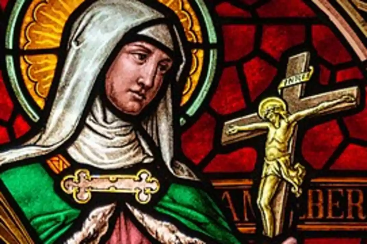 Vidriera de una santa con un crucifijo en la mano y un fondo rojo. Vidriera de una santa con un crucifijo en la mano y un fondo rojo.