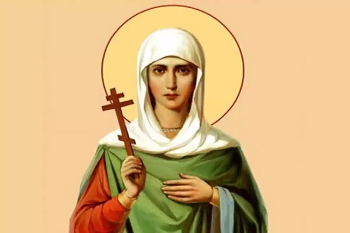 Una imatge d'una figura religiosa amb un halo daurat sostenint una creu ortodoxa i vestida amb túnica verda i mantell blanc. Una imatge d'una figura religiosa amb un halo daurat sostenint una creu ortodoxa i vestida amb túnica verda i mantell blanc.