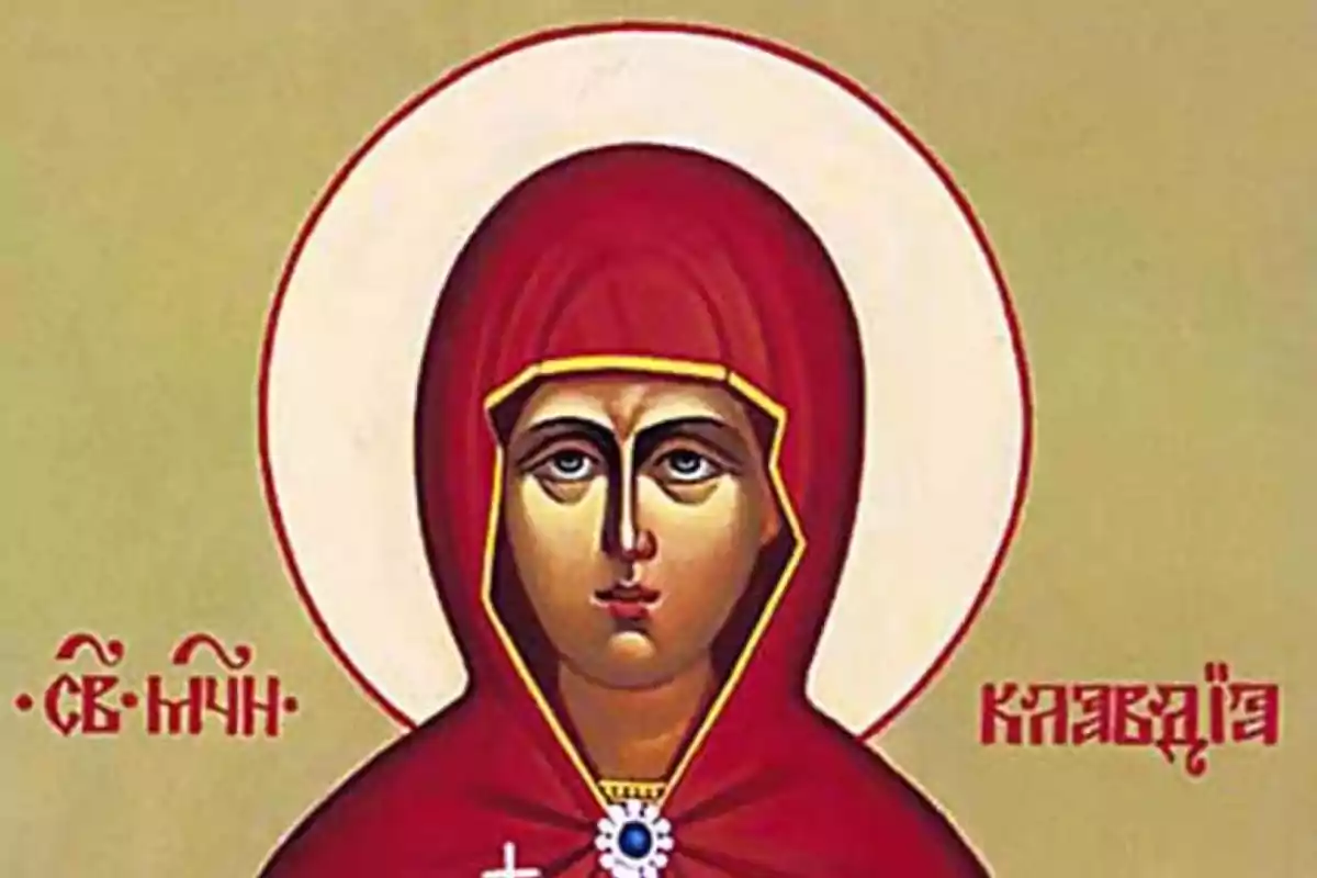 Una imatge d'una icona religiosa que mostra una figura amb un mantell vermell i un halo blanc sobre un fons beix amb inscripcions en un idioma eslau. Una imatge d'una icona religiosa que mostra una figura amb un mantell vermell i un halo blanc sobre un fons beix amb inscripcions en un idioma eslau.