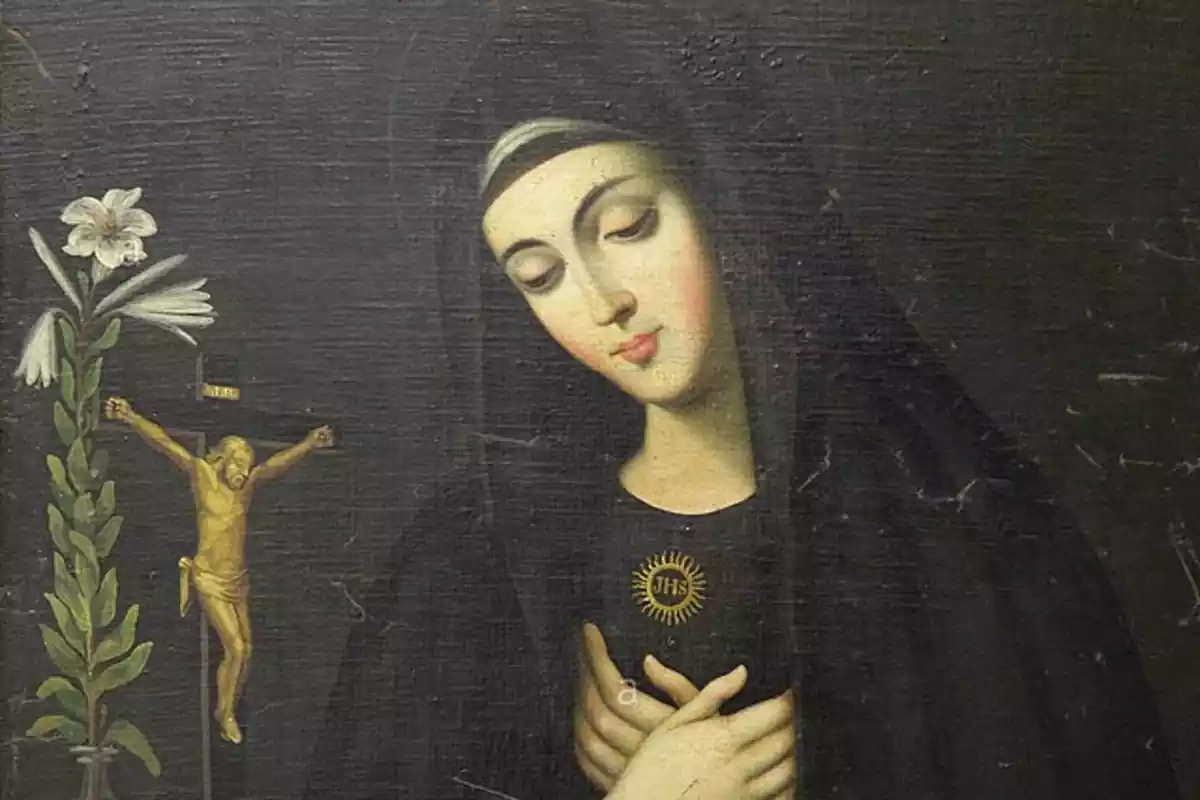 Primer pla a color de Santa Mariana de Jesús de Paredes amb un crucifix Primer pla a color de Santa Mariana de Jesús de Paredes amb un crucifix