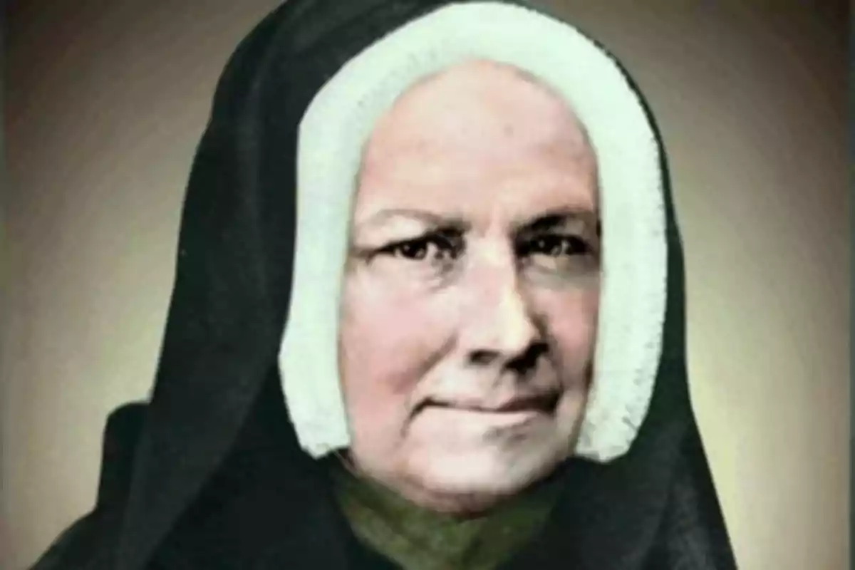 Dona gran amb hàbit religiós negre i còfia blanca mirant al front Dona gran amb hàbit religiós negre i còfia blanca mirant al front