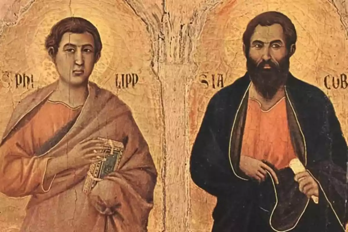 Dues figures religioses en una icona antiga, una sostenint un llibre i l'altra un pergamí, amb halos daurats sobre els seus caps.