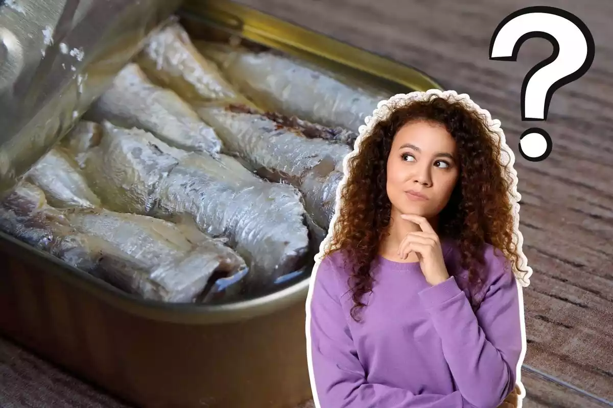 Dona pensant mirant una llauna de sardines