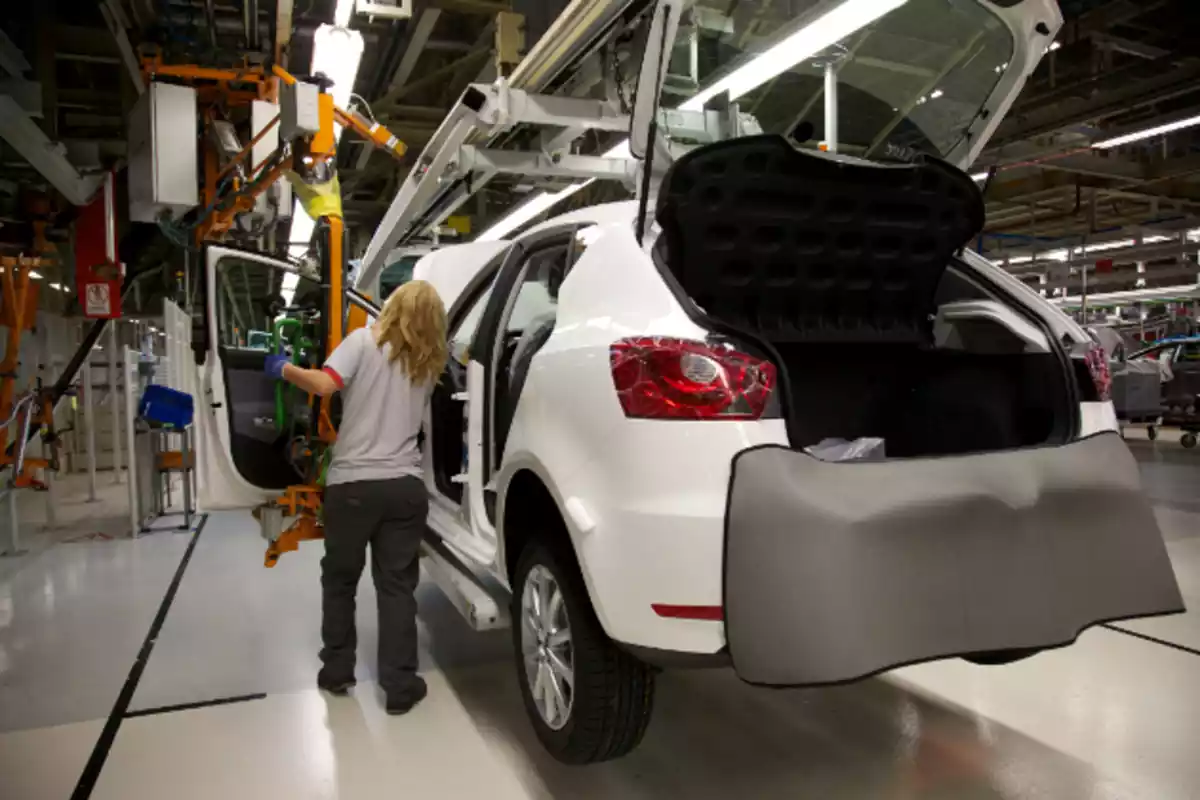 A woman works on the assembly line at the Seat Martorell factory