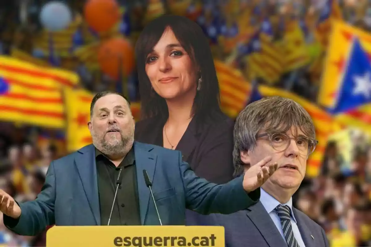 Tres personas en primer plano con banderas catalanas de fondo.