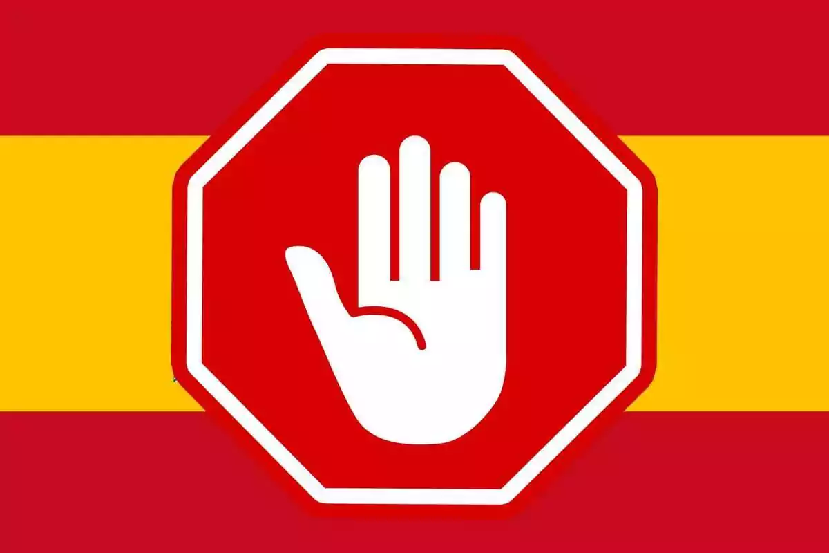 Muntatge amb la bandera d´Espanya i un senyal de stop