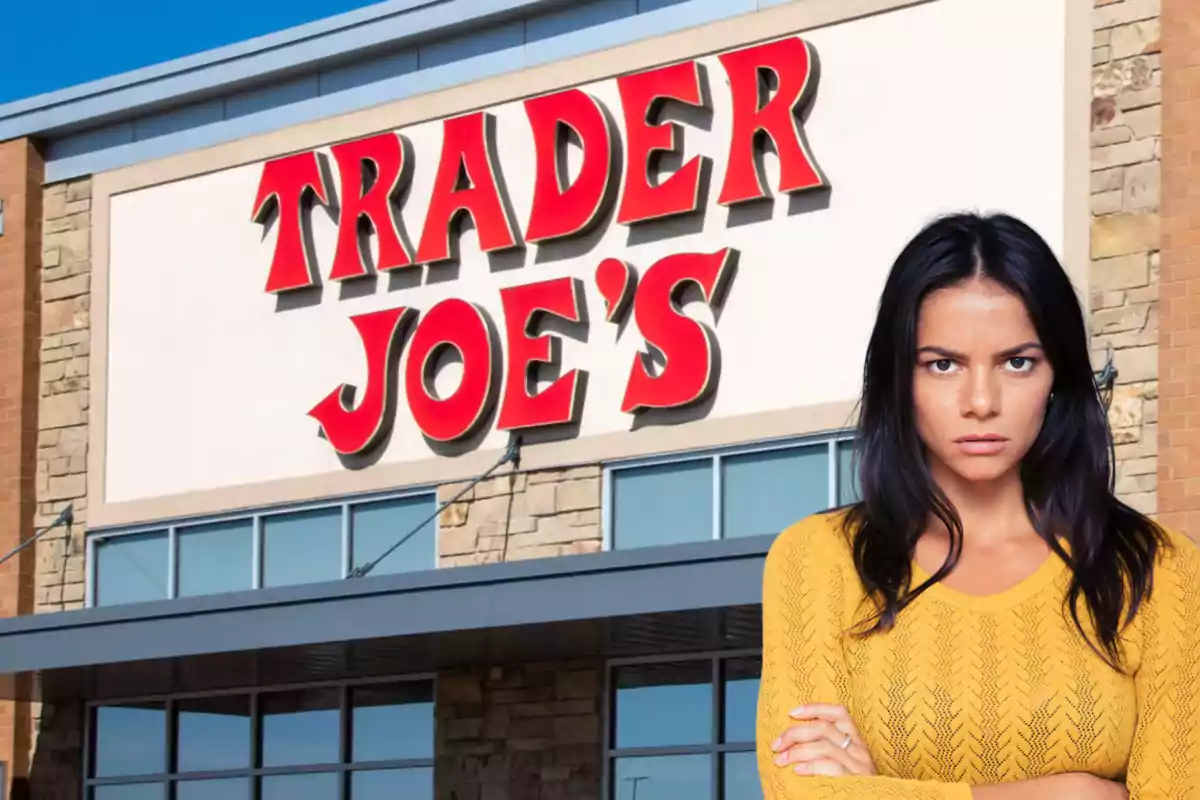 A woman with a serious expression in front of a Trader Joe's building.