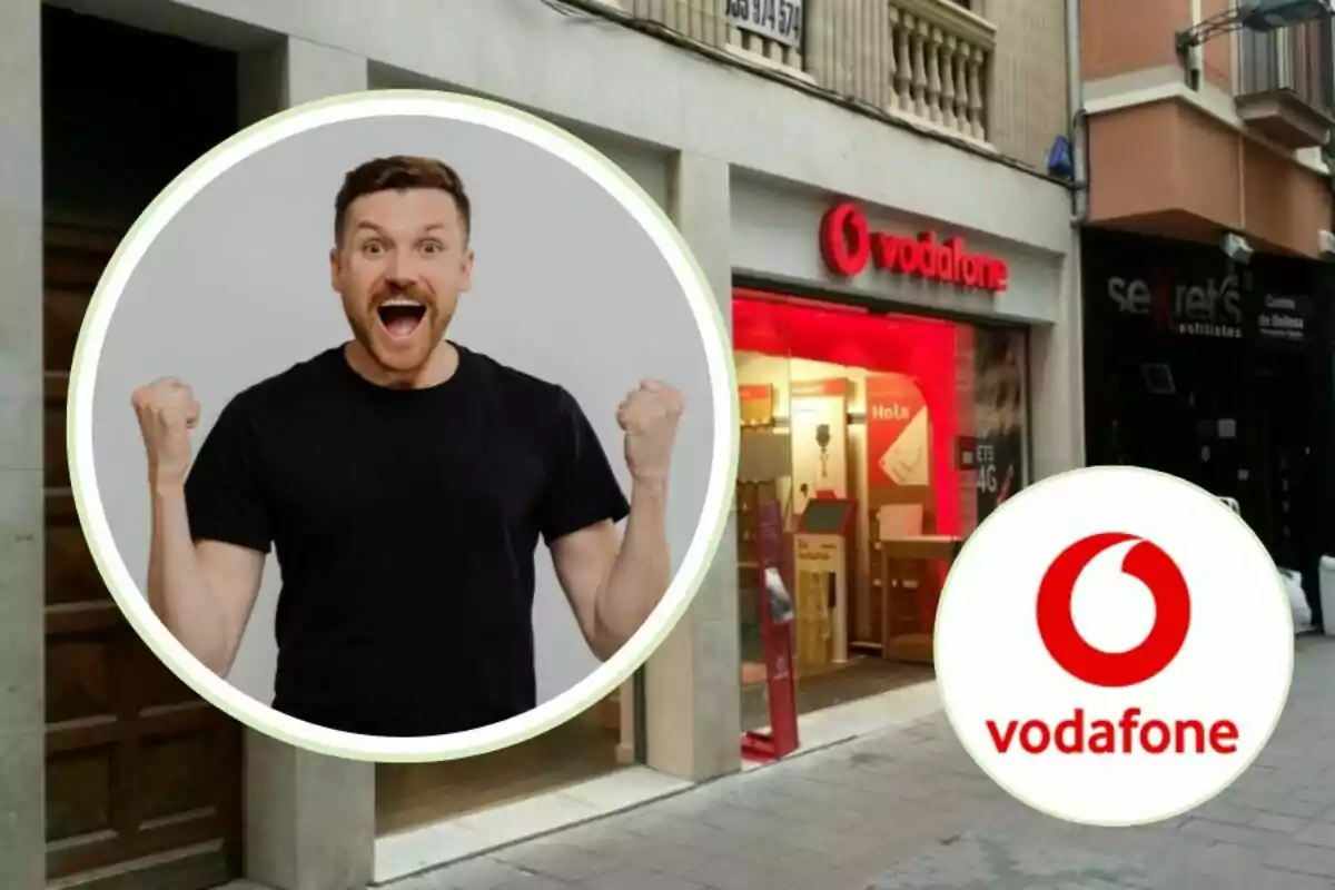 Hombre emocionado con camiseta negra junto a una tienda de Vodafone y el logotipo de Vodafone.