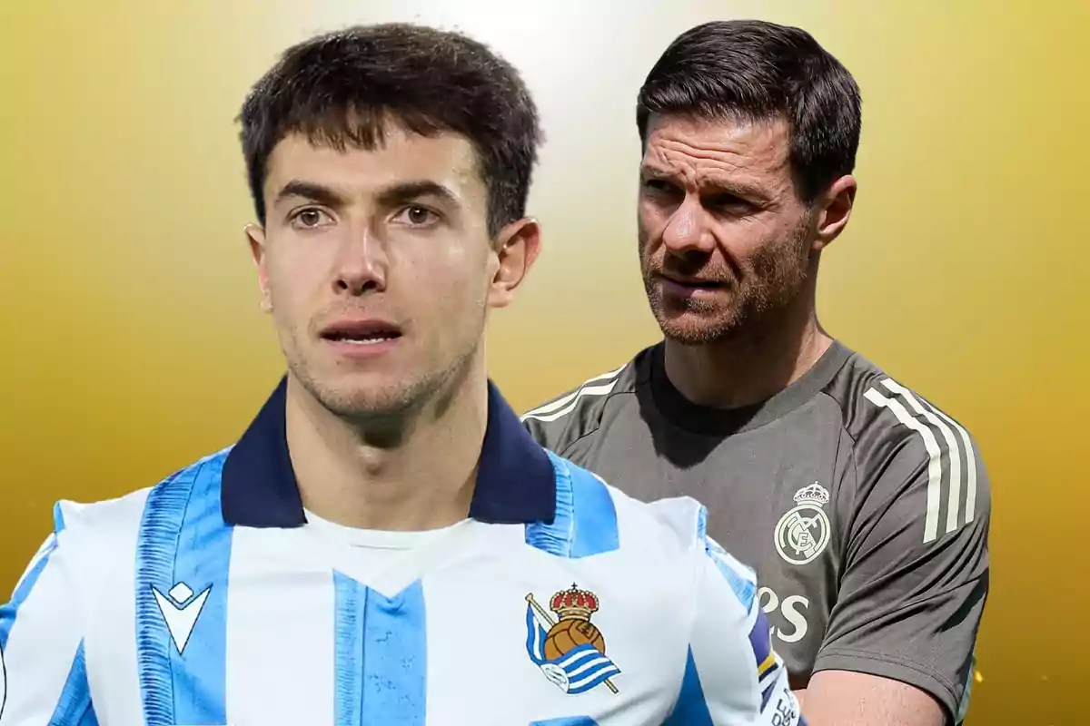 Two men appear in the image, one in the foreground wearing the Real Sociedad uniform and another in the background wearing Real Madrid sportswear against a yellow background.